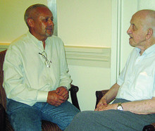 John Zeisel ’65, ’71 GSAS (left) talks with one of his Alzheimer’s patients.  Photo: Courtesy Hearthstone Alzheimer Care
